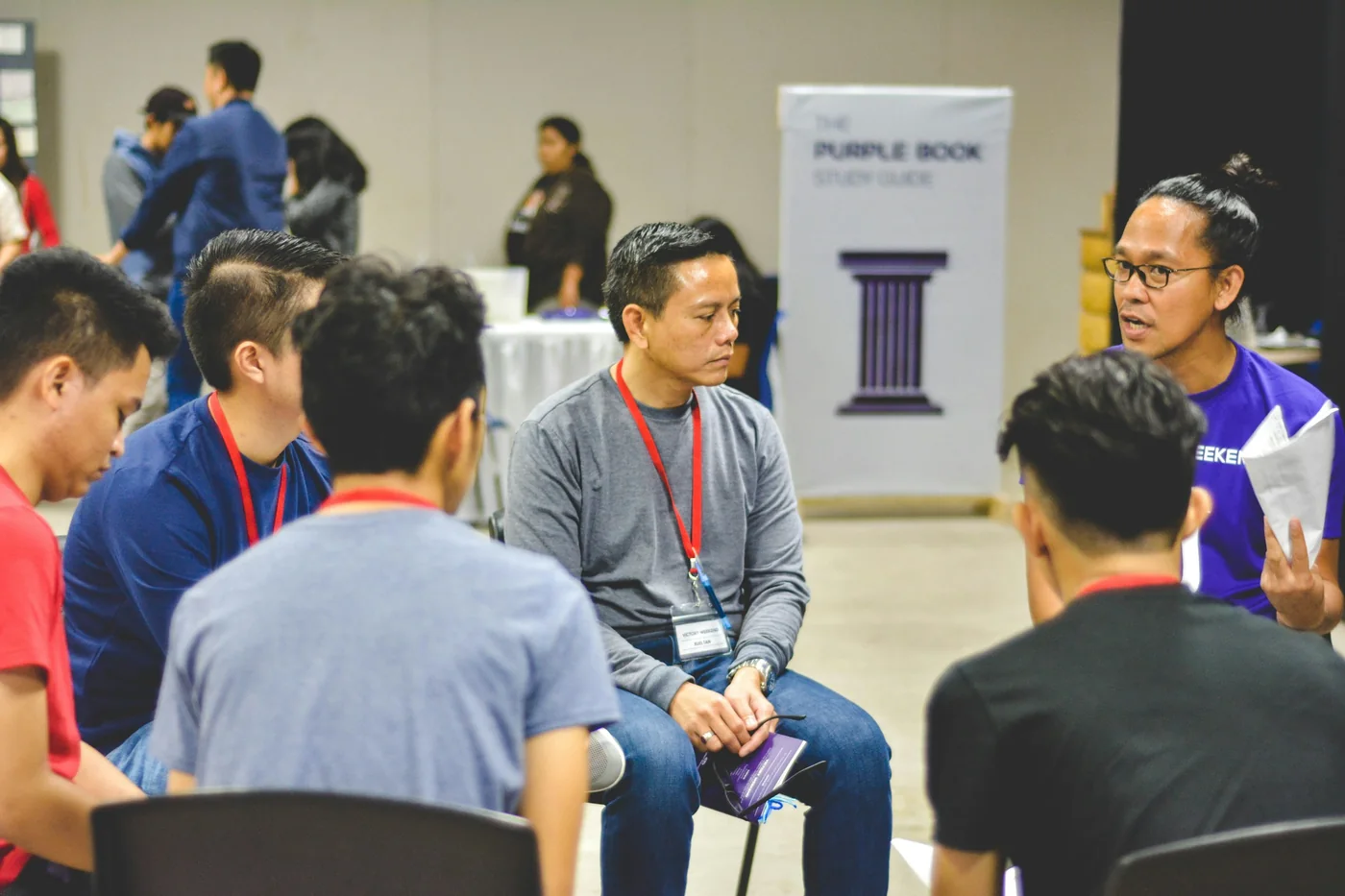 A group of young adults talking during a group activity
